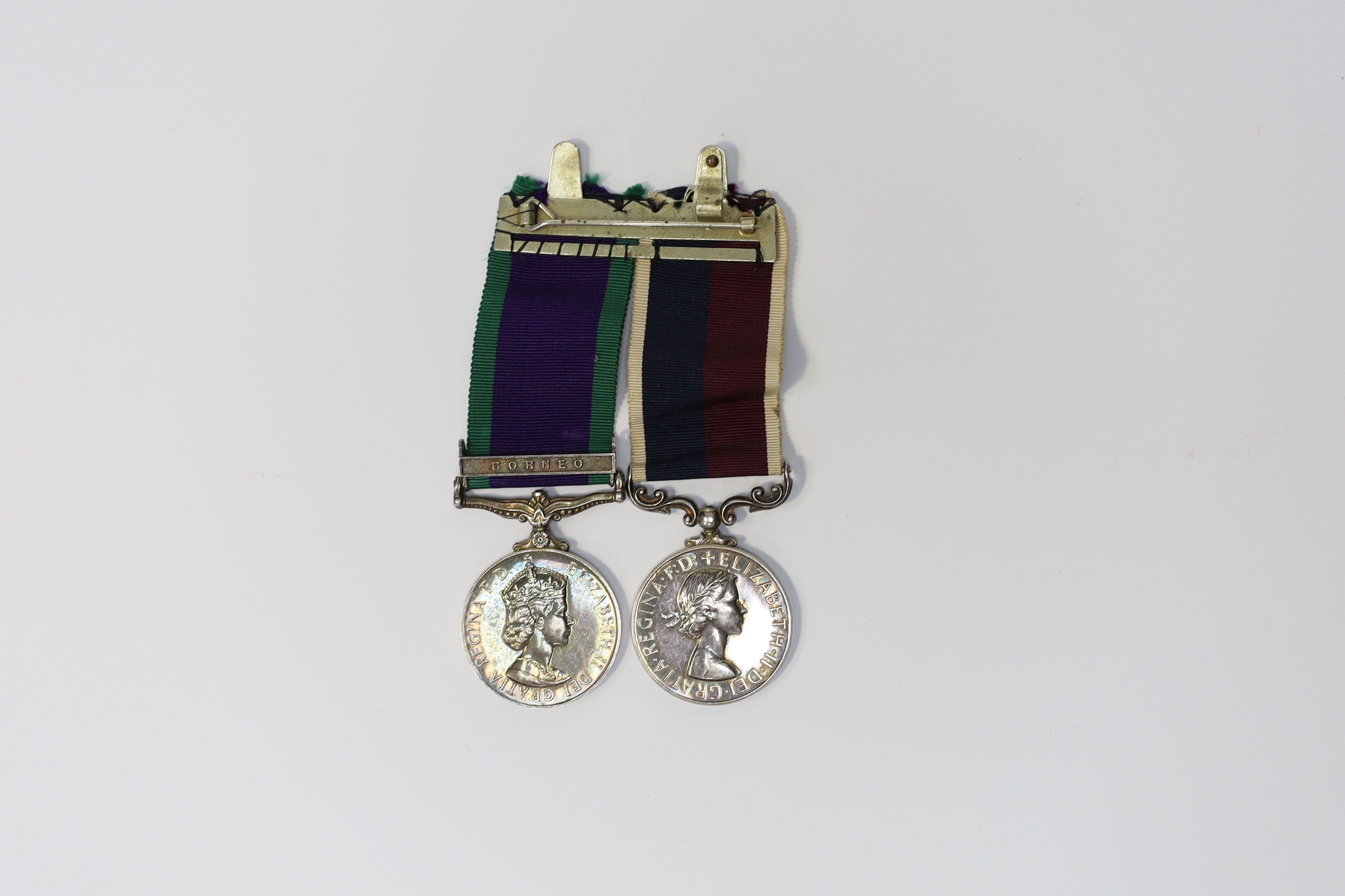 An ERII RAF medal pair awarded to Cpl. A.F.G. Pitcher RAF, comprising; a General Service Medal with a bar for Borneo and an RAF Long Service Medal, mounted on a common pin. Condition - fair to good